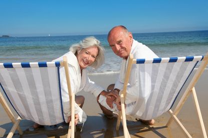Portrait of senior couple sitting in deckchairs