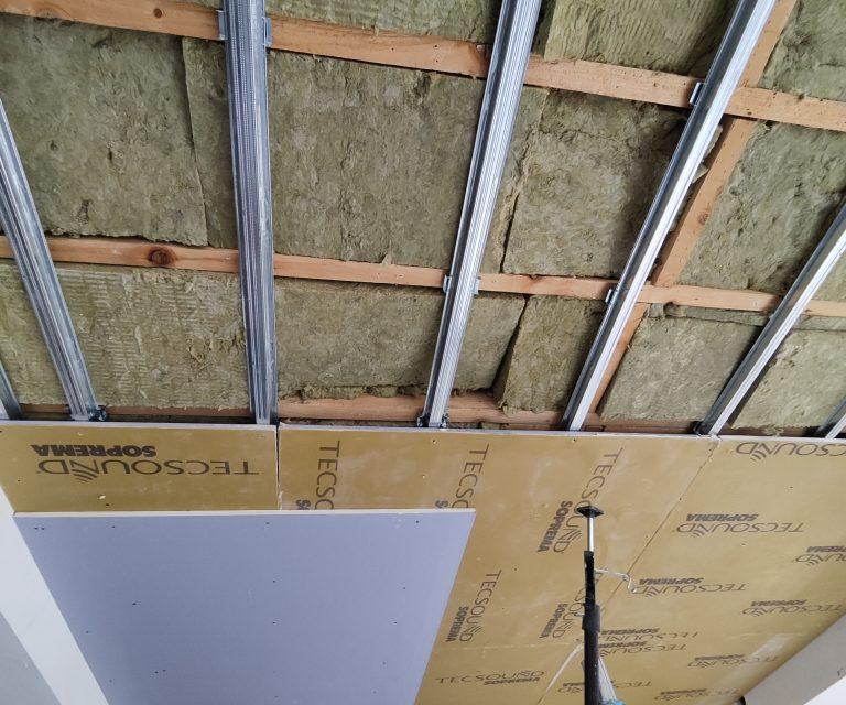 Layers of insulation in a utility room wall