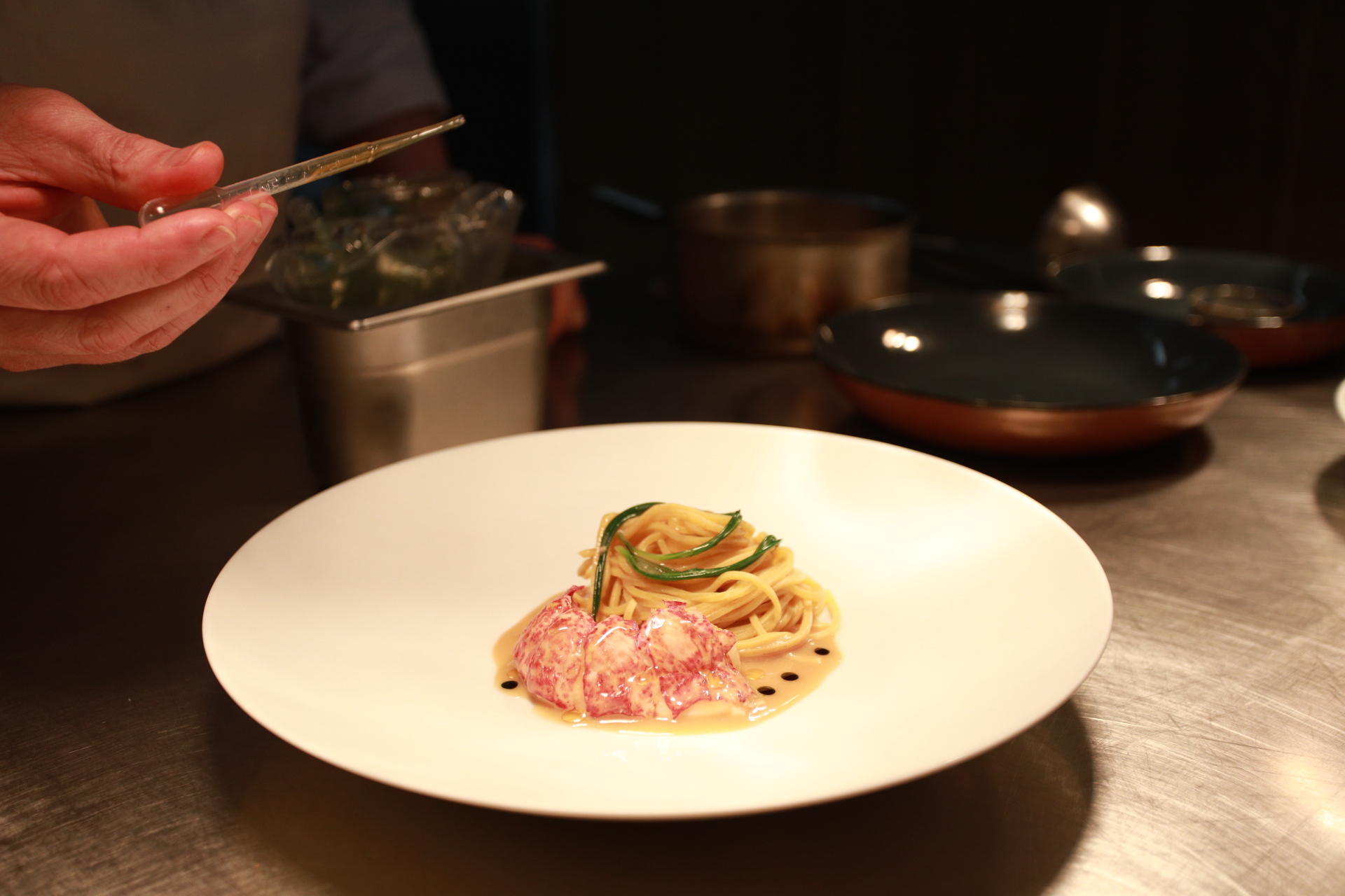 Lobster Tagliolini Native Lobster Tail steamed in its shell, Fresh Trivet Pasta, Lobster and Miso Broth by Trivet Restaurant, London.