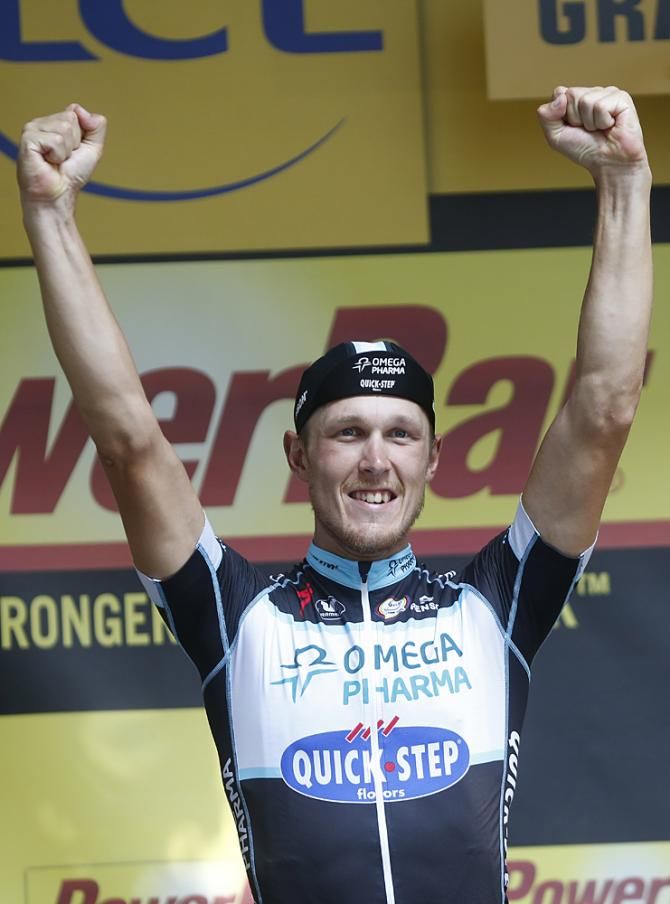 Matteo Trentin (Omega Pharma - QuickStep) stands on the podium as the winner of stage 7