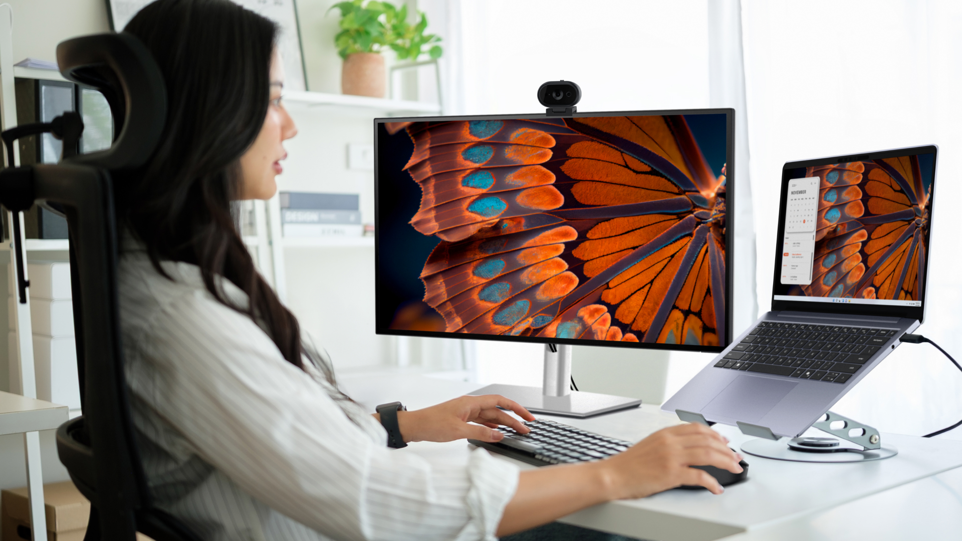 Woman working on a Dell Pro laptop