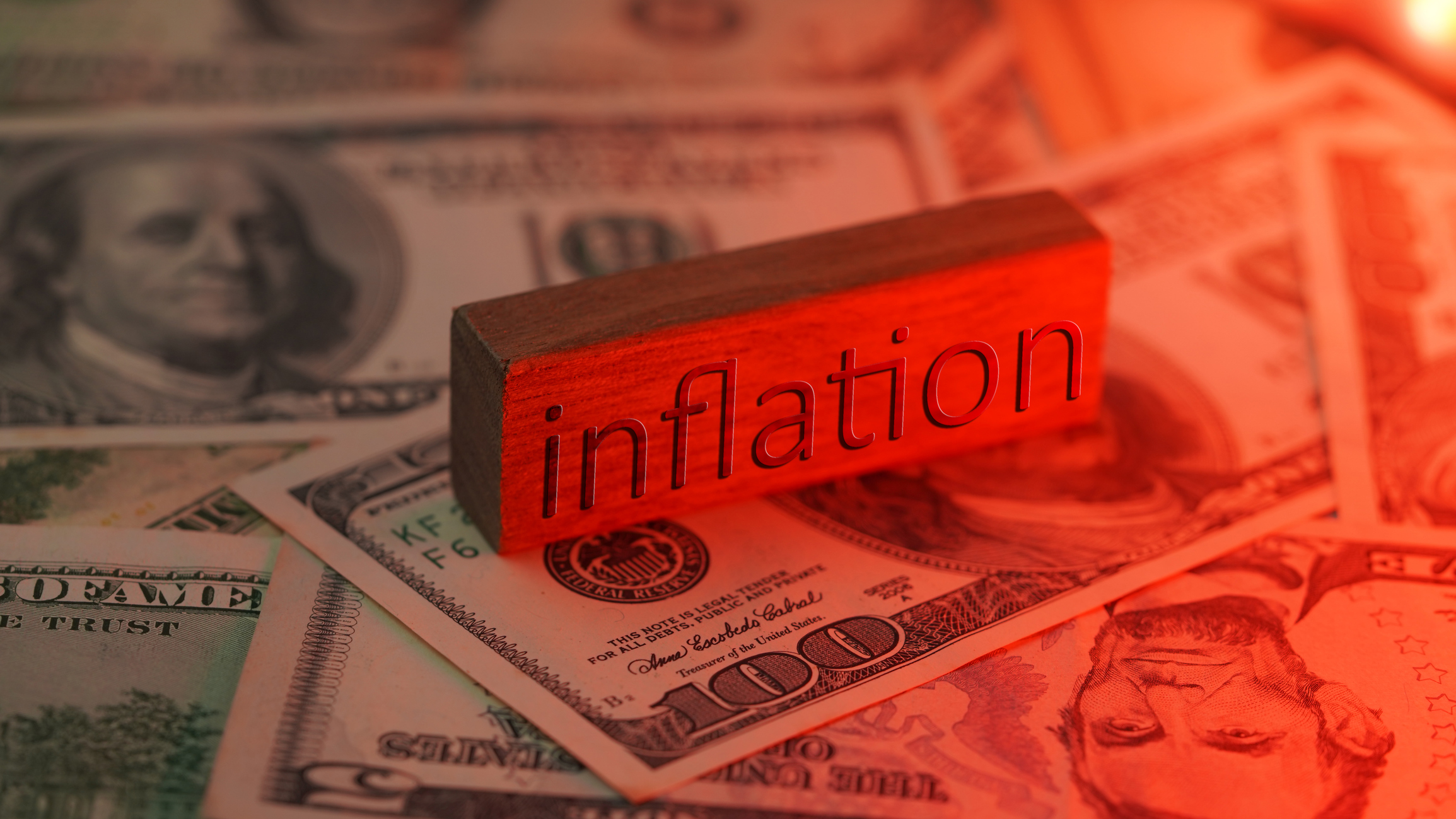 Inflation in red tone and American dollar noate