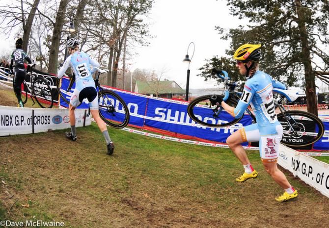 Elite Women running one of two sets of barriers