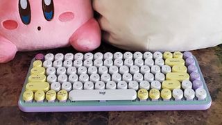 A Logitech Pop Keys keyboard on a counter