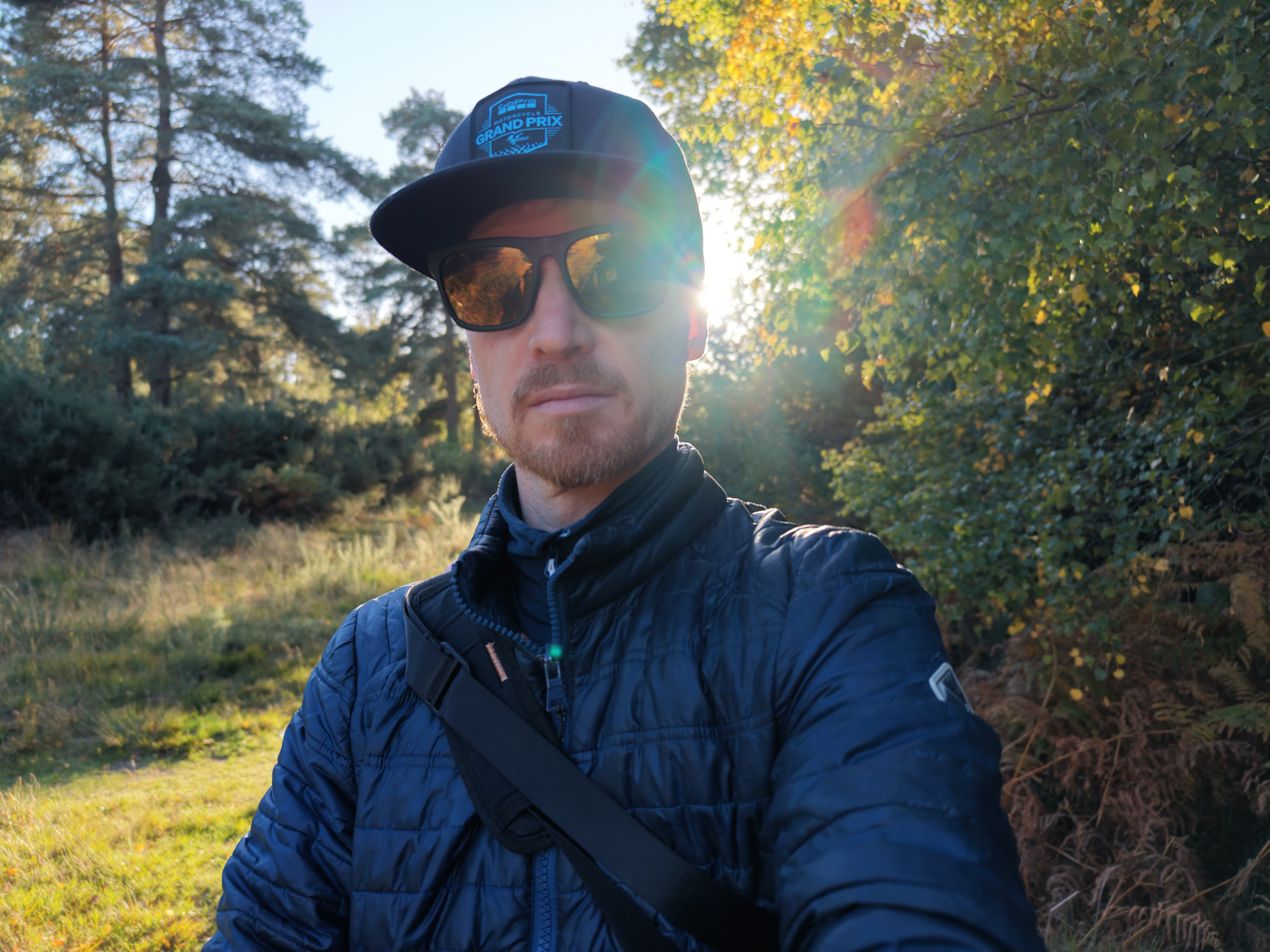 DJI Mini 5 Pro sample images: male pilot in sunglasses, backlit