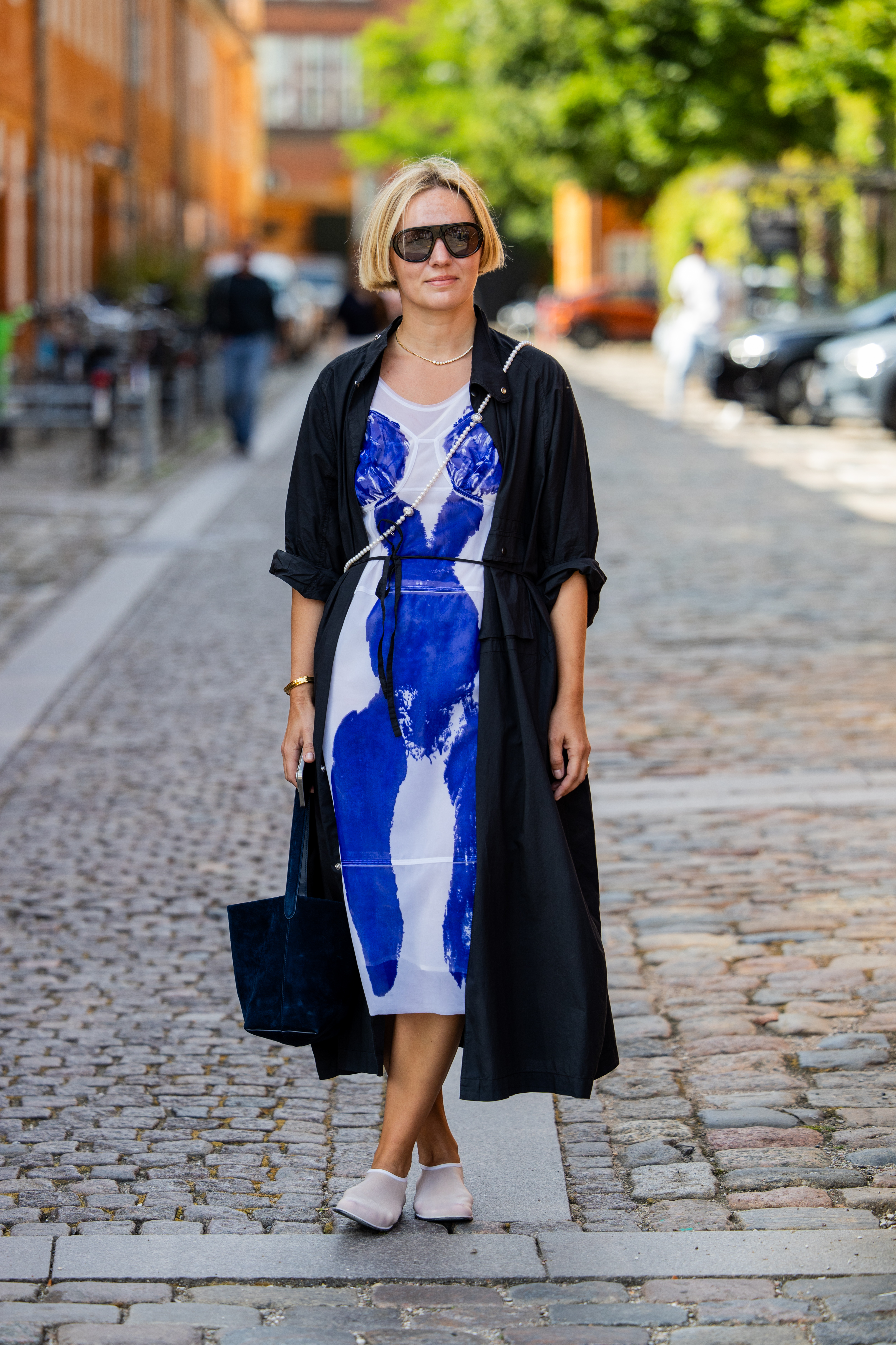 Woman wearing cobalt blue dress during Copenhagen Fashion Week.