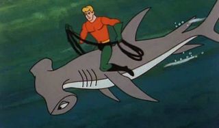 Aquaman riding shark