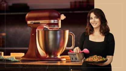 Nigella Lawson cutout next to a copper KitchenAid on a counter