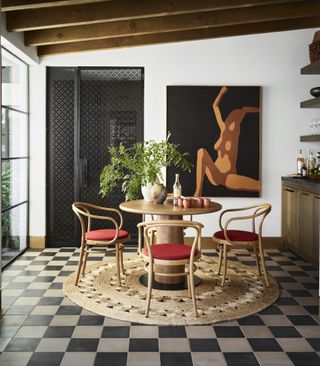 a dining room with a checkerboard floor