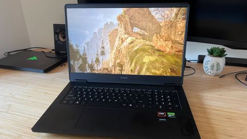 HP Omen 17 gaming laptop running The Talos Principle 2 on a wooden desk