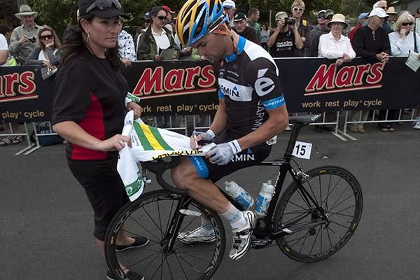 I'll sign this one but i wouldn't mind taking one of these home in a few hours: Jack Bobridge (Garmin Cervelo) signs a national jersey prior to the start in Buninyong.