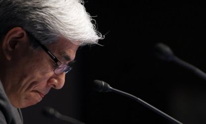 Sony CFO Masaru Kato looks down during his statement about the tech giant's largest annual loss since 1996.