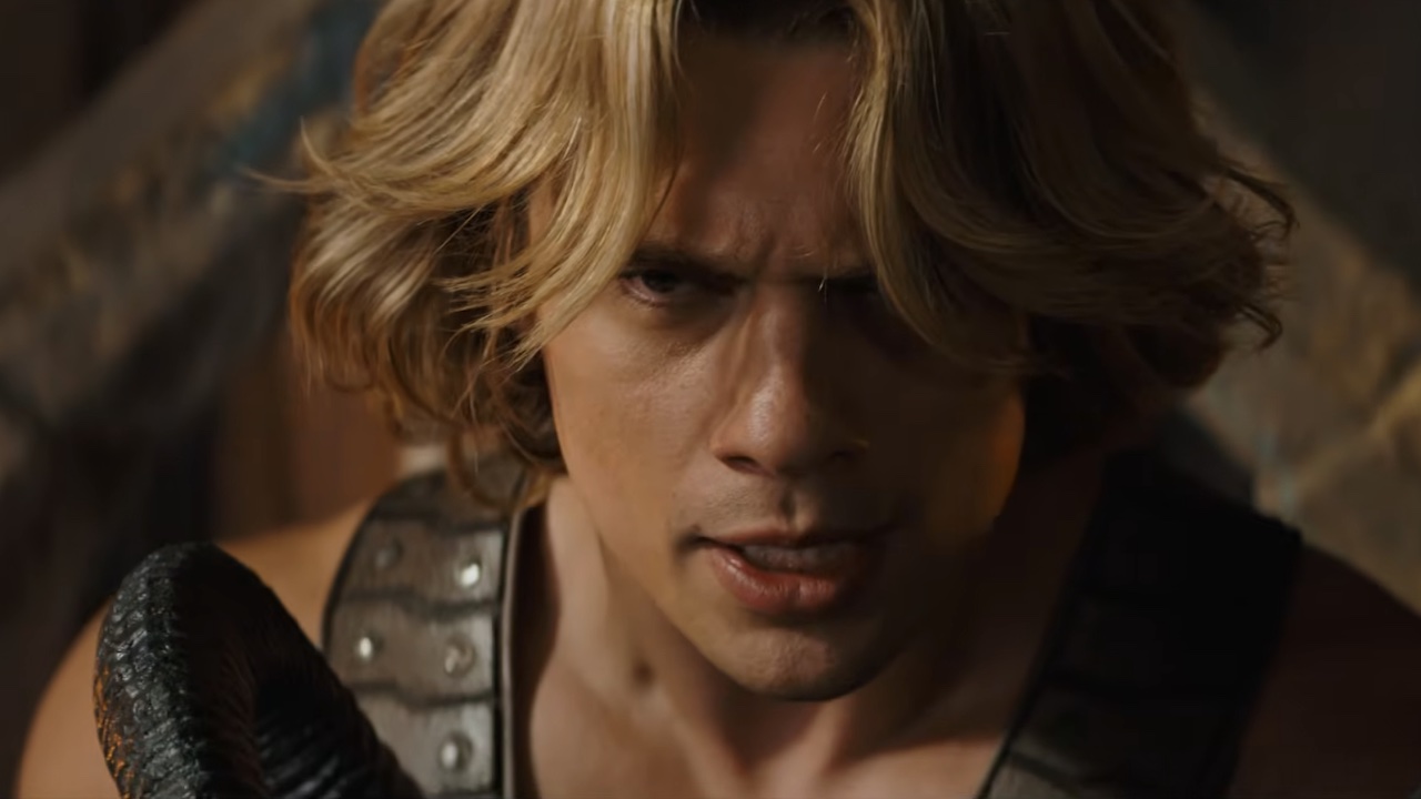 Nicholas Galitzine in He-Man's costume fighting Skeletor. 