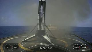 The SpaceX Falcon 9 rocket that launched the company's Transporter-4 rideshare mission stands atop its drone ship A Shortfall Of Gravitas after a landing at sea.