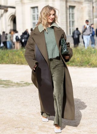 A woman wearing a khaki layered look