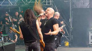 Disturbed&rsquo;s David Draiman performing onstage at Black Sabbath and Ozzy Osbourne&rsquo;s farewell gig