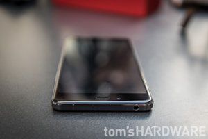 Speakers, microUSB port, and slightly curved glass display