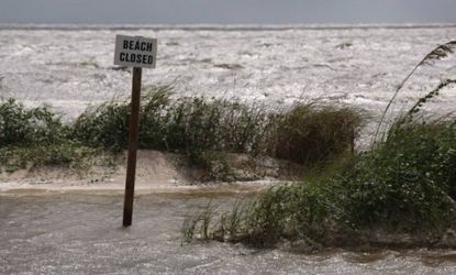 Sea water surges onto the beach in Waveland, Miss., ahead of the arrival of Hurricane Isaac. The Category 1 storm made landfall in Louisiana early on Wednesday. 