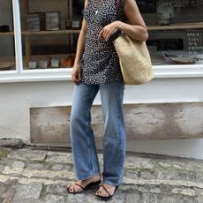Woman in jeans and polka-dot dress