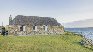A stout stone home on the coast