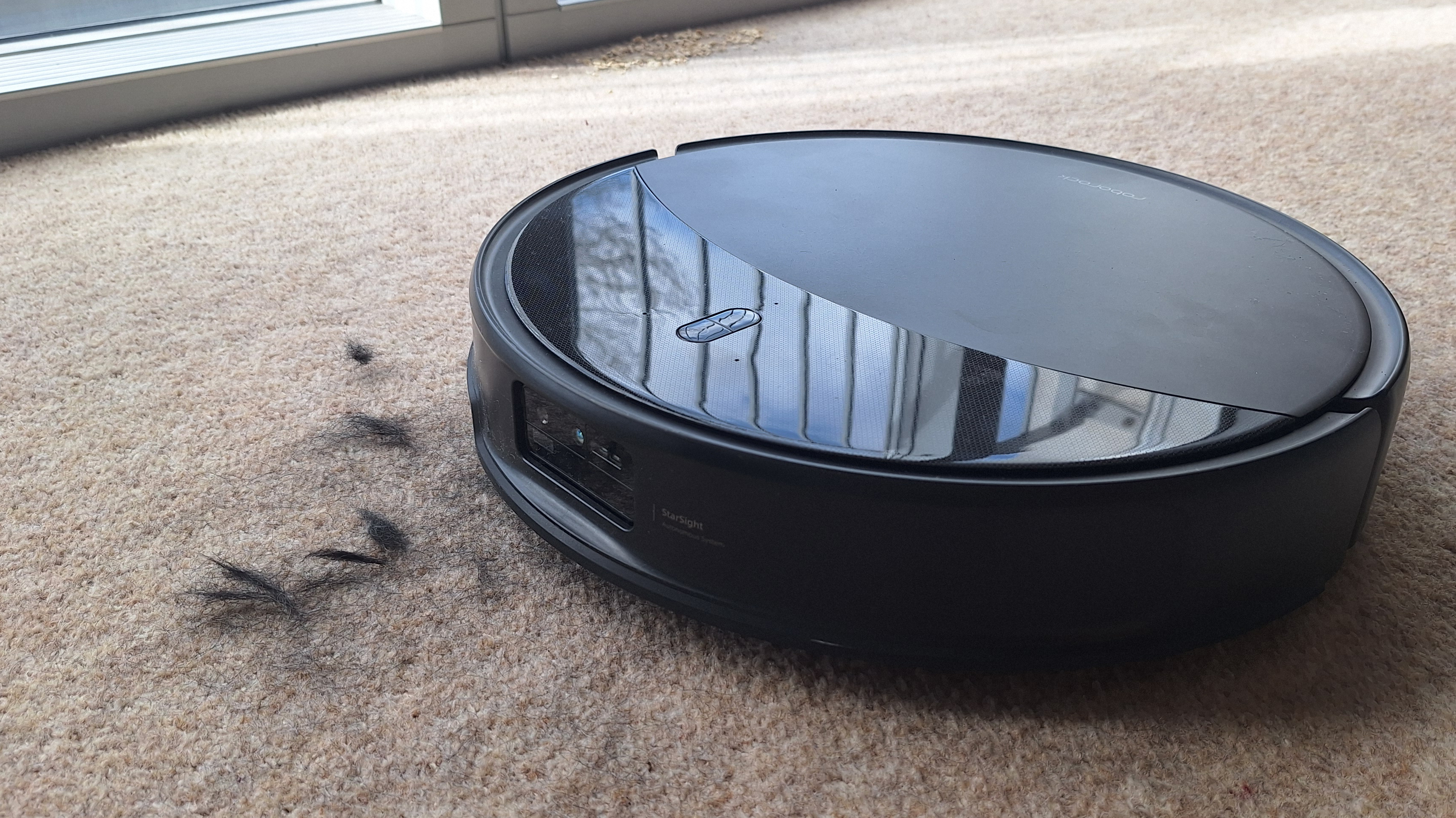 Roborock Saros 20 clearing pet hair from a carpeted floor