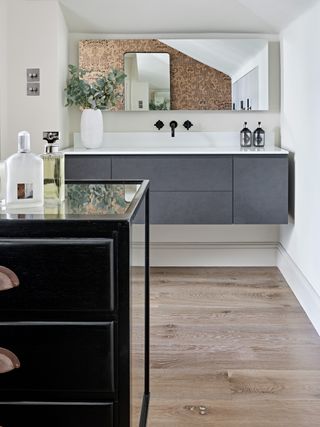Modern bathroom with grey vanity unit and large mirror