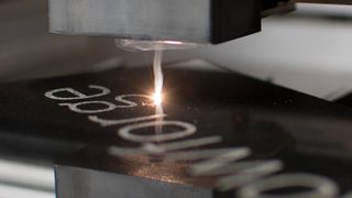 The best Glowforge machines; a photo of a laser cutting into metal