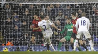 Clint Dempsey (wearing the number 2) scores for Tottenham against Manchester United in January 2013.