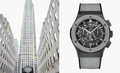 Grey wrist watch with skyscraper in background