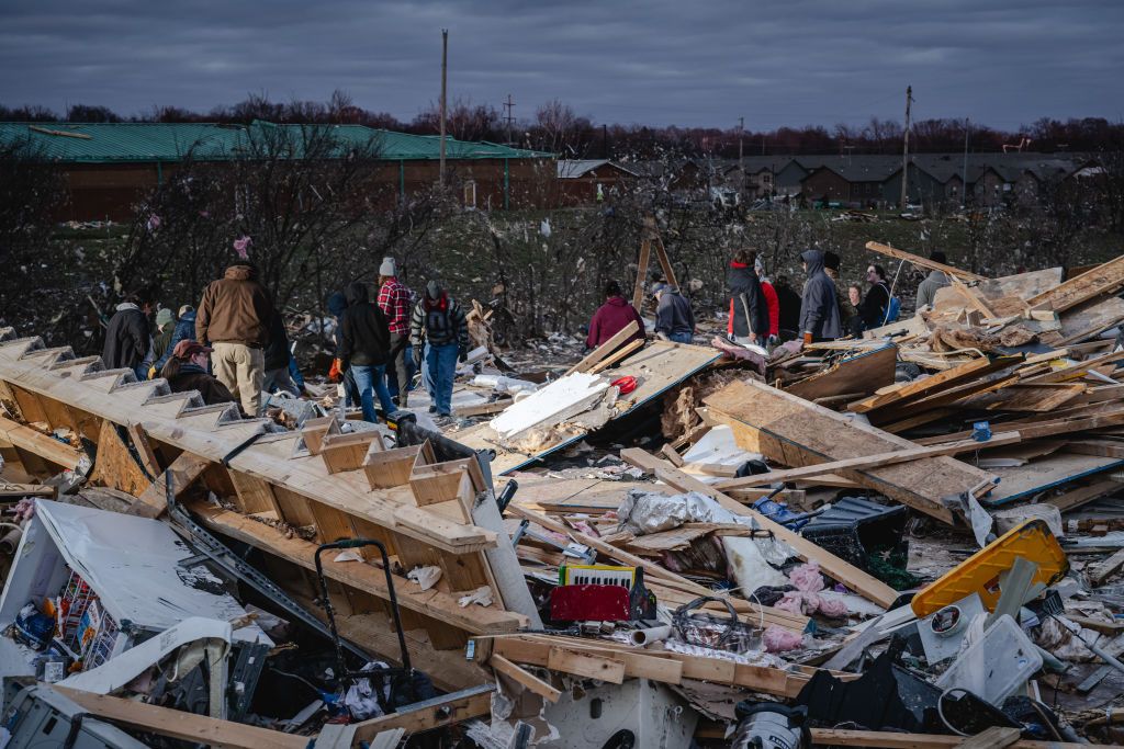 CLARKSVILLE TENNESSEE DECEMBER 10 Residents and visitors work to clear debris in search of pets and belongings of a destroyed home in the aftermath of a tornado on December 10 2023 in Clarksville Tennessee Multiple longtrack tornadoes were reported in northwest Tennessee on December 9th causing multiple deaths and injuries and widespread damage Photo by Jon CherryGetty Images