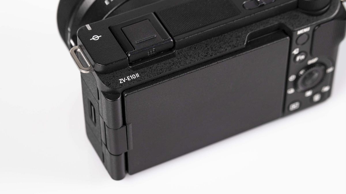 Sony ZV-E10 II on reflective surface and white background