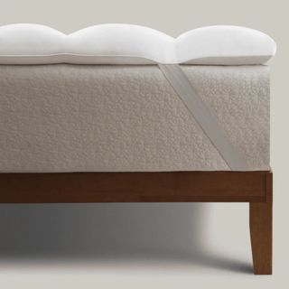 Coop Retreat Mattress Topper on corner of bed