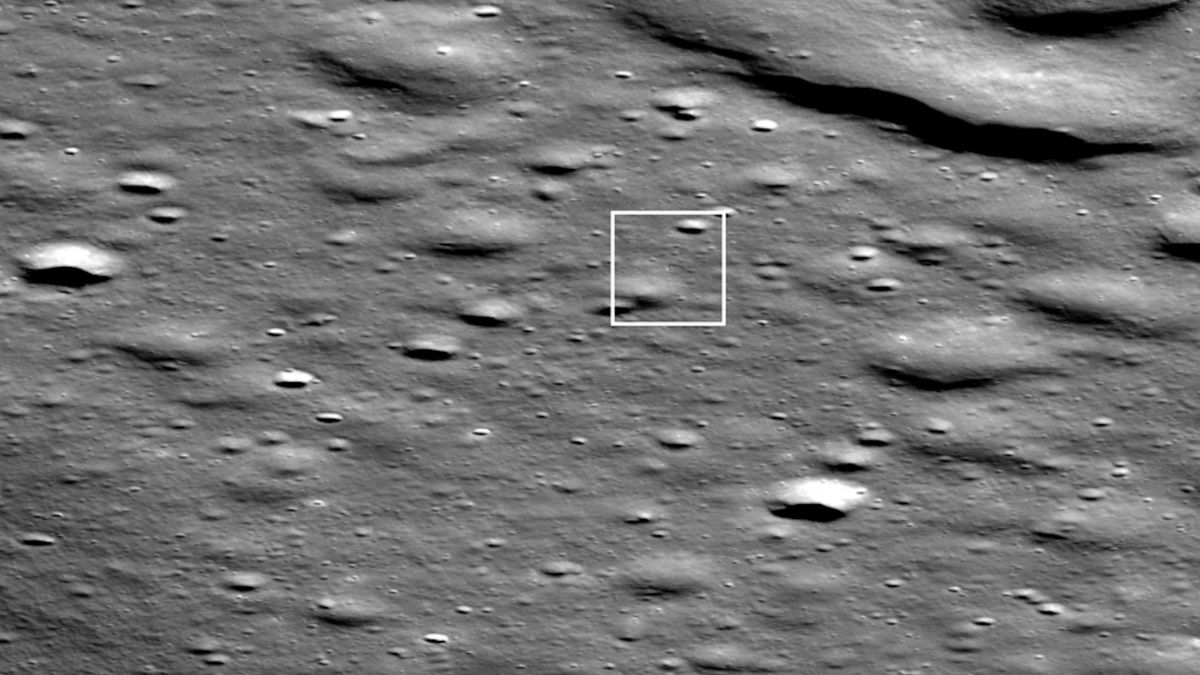 photo of the cratered lunar surface taken by a moon orbiter, with a small white box superimposed to show the location of a lunar lander