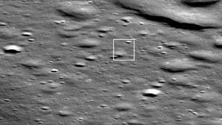 Firefly Aerospace’s Blue Ghost moon lander is seen as bright pixel casting a shadow in the middle of the box in this photo, which was captured by NASA’s Lunar Reconnaissance Orbiter on March 2, 2025.