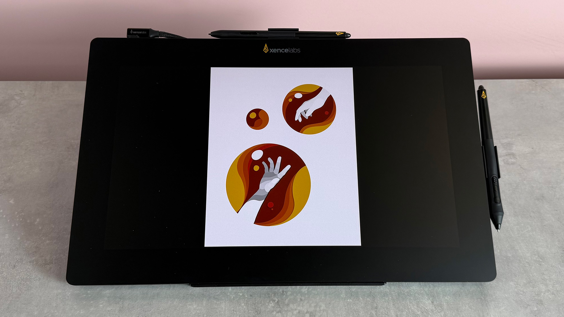 The Xencelabs Pen Display 16 showing a 3D vector showing hands in red, orange and yellow bubbles.