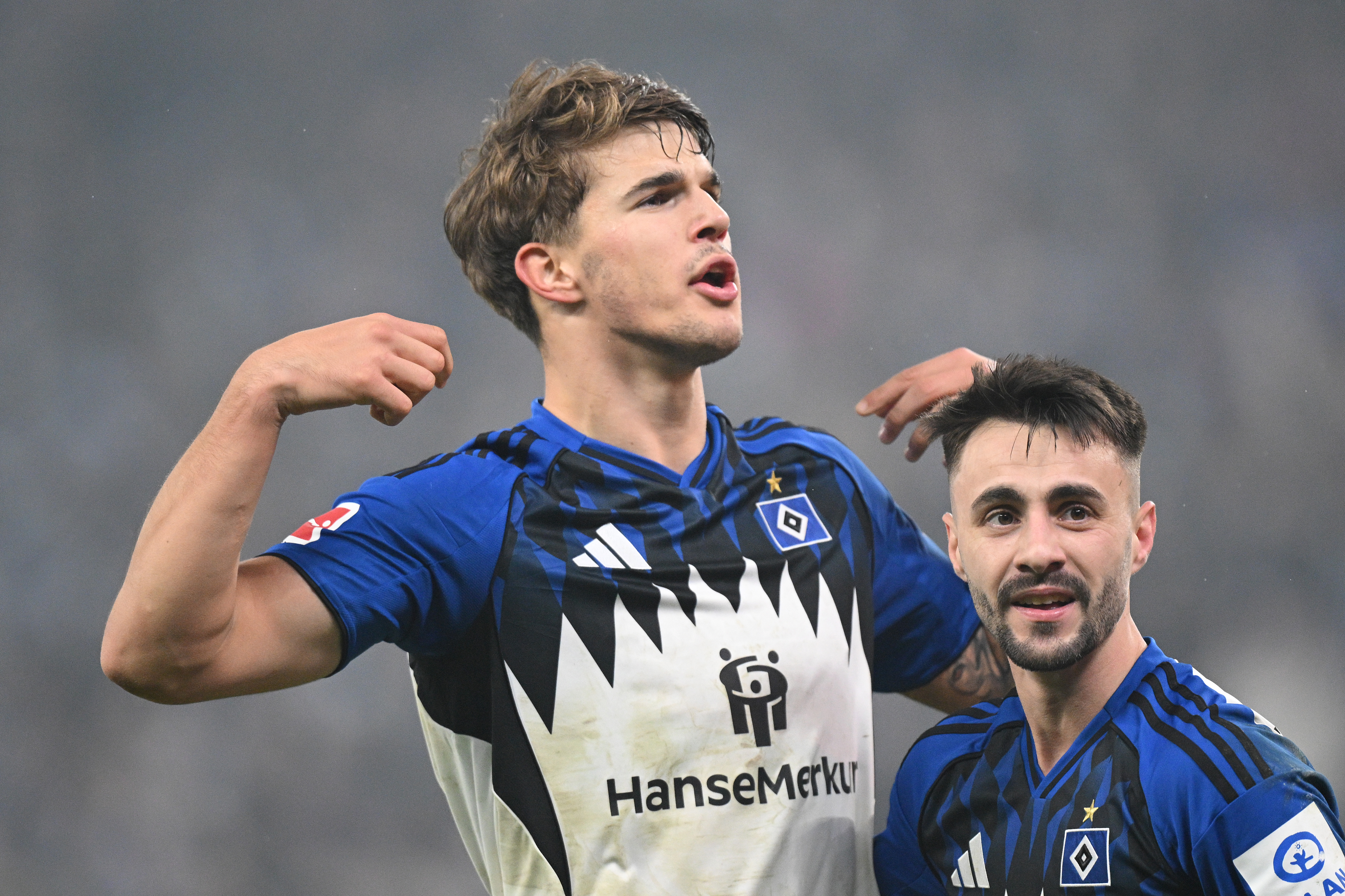 HAMBURG, GERMANY - DECEMBER 07: Luka Vuskovic of Hamburger SV (L) celebrates scoring his team&amp;amp;apos;s second goal with teammate Fabio Vieira (R) during the Bundesliga match between Hamburger SV and SV Werder Bremen at Volksparkstadion on December 07, 2025 in Hamburg, Germany. (Photo by Stuart Franklin/Getty Images)