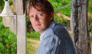 Kris Marshall smiling as Detective Inspector Humphrey Goodman in Death in Paradise