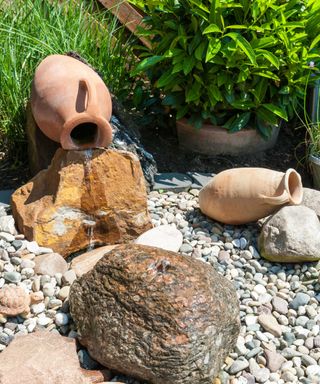 gravel and terracotta pot water feature