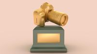 A 3D rendering of a gilded DSLR camera trophy