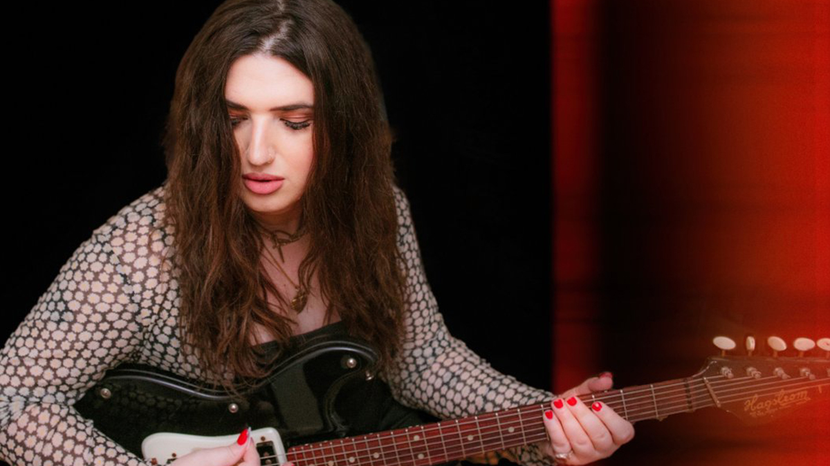Ella Feingold playing a Hagstrom guitar