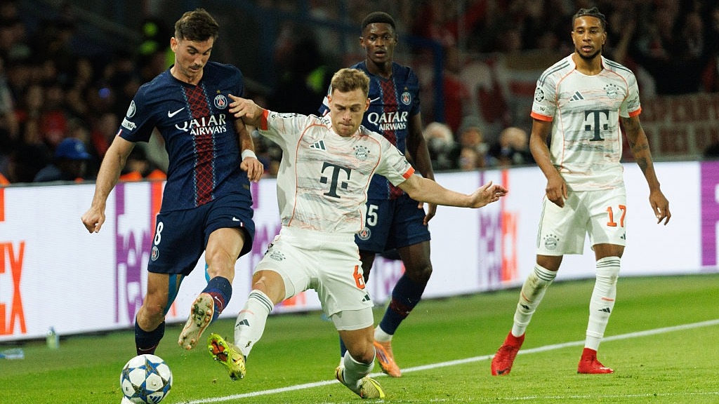 Joshua Kimmich of Bayern Munich and Fabian Ruiz of PSG compete for the ball in the UEFA Champions League 2025/26