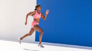 Woman running in Asics sneakers