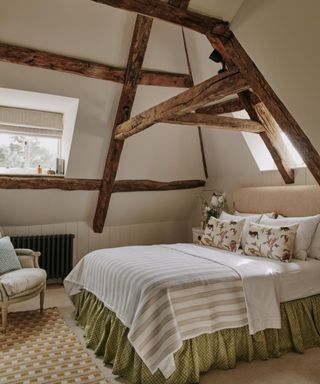 Bedroom design in a Cotswold manor by Sims Hilditch with exposed beams, photograph Neil Speakman