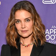 Katie Holmes wore a custom GapStudio suit with the high-vamp heels trend