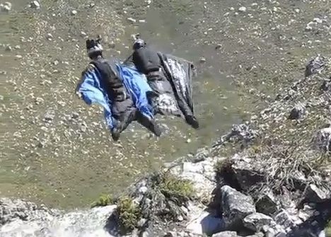 Corliss, in black, just after leaping from a cliff on Table Mountain.