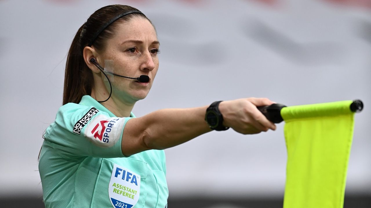 Assistant referee Sian Massey-Ellis flags for offside in a Premier League match 