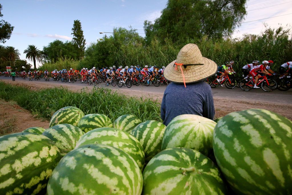 A local watermelon seller watches on