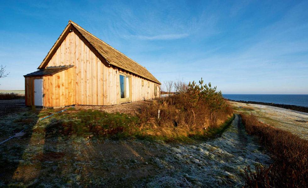 Une maison rustique de style chalet avec une vue imprenable sur les Highlands