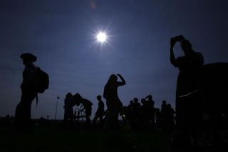 people gather to watch a solar eclipse.