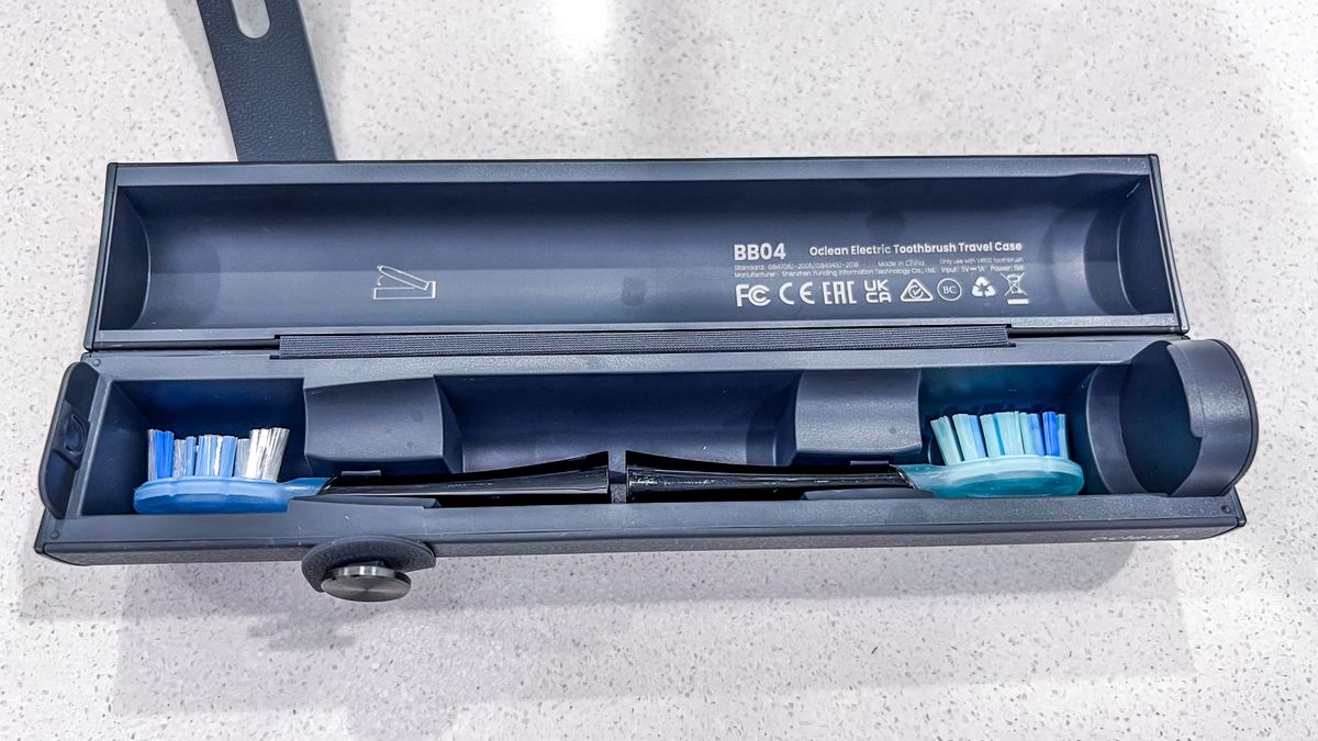 Two Oclean X Ultra S replacement brush heads stored inside the travel case
